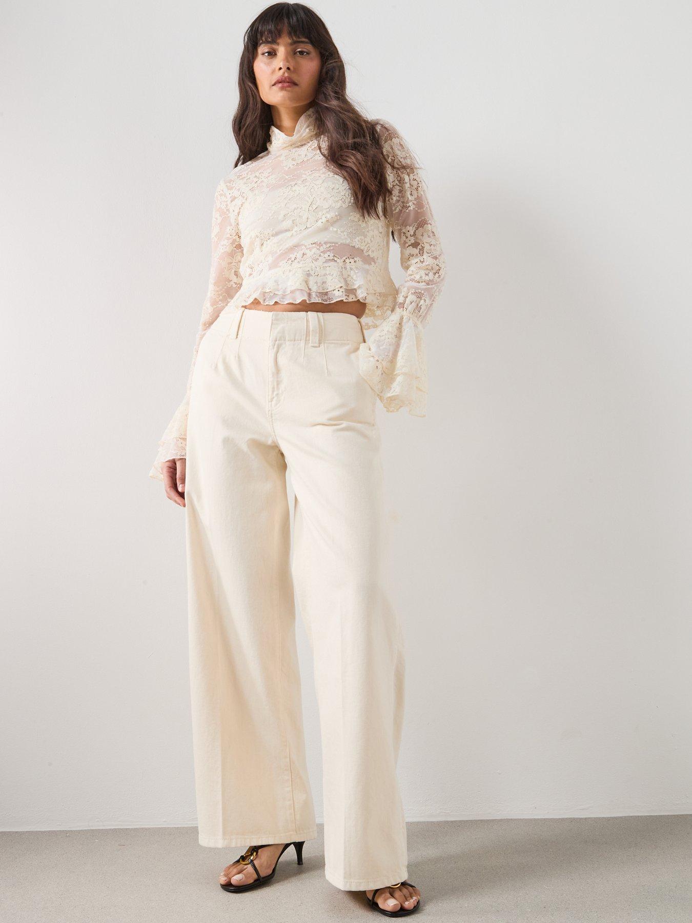 mango-ruffled-embroidered-blouse-beigeback