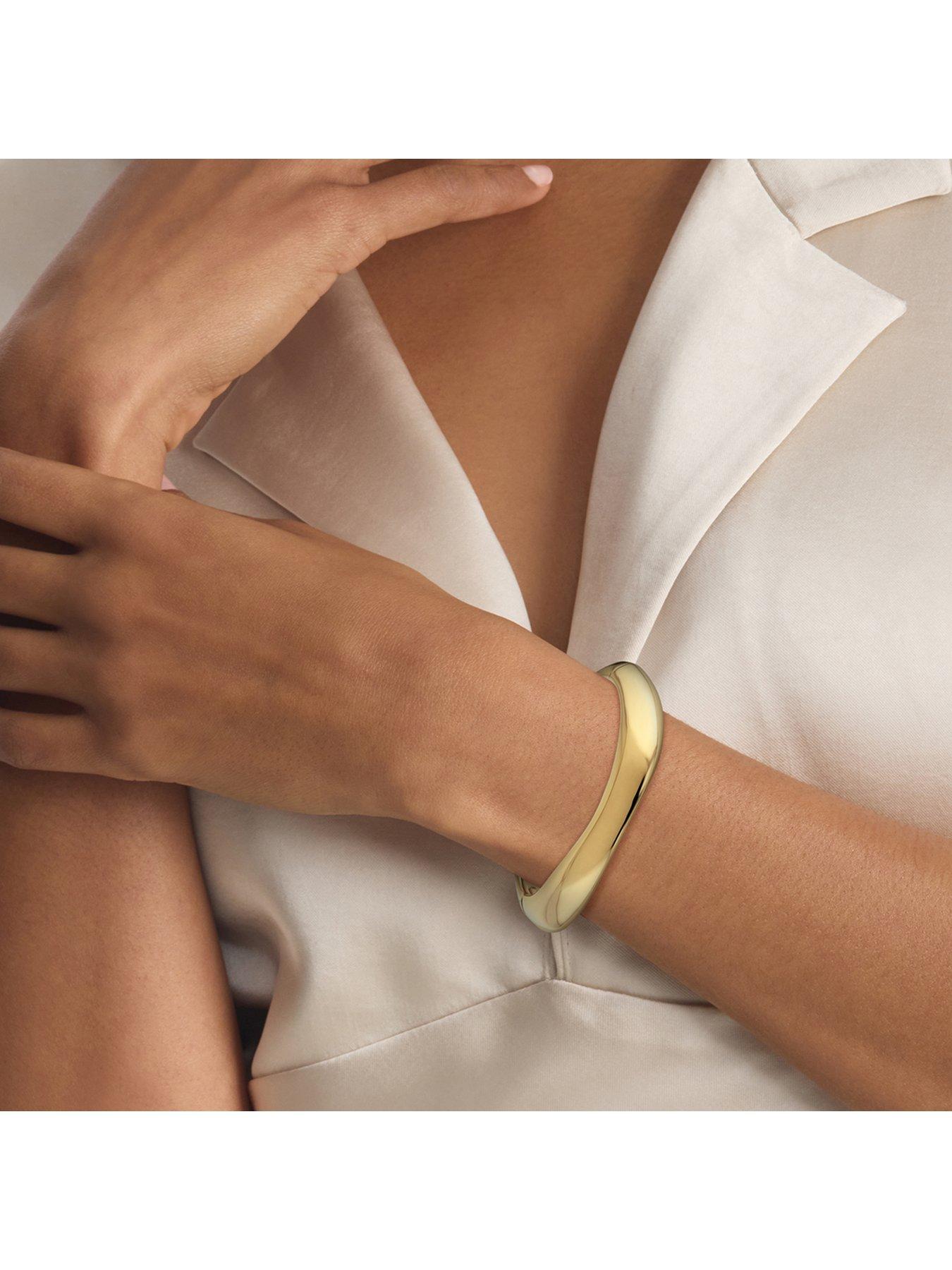 calvin-klein-womens-ck-sculpted-gold-plated-bangleback
