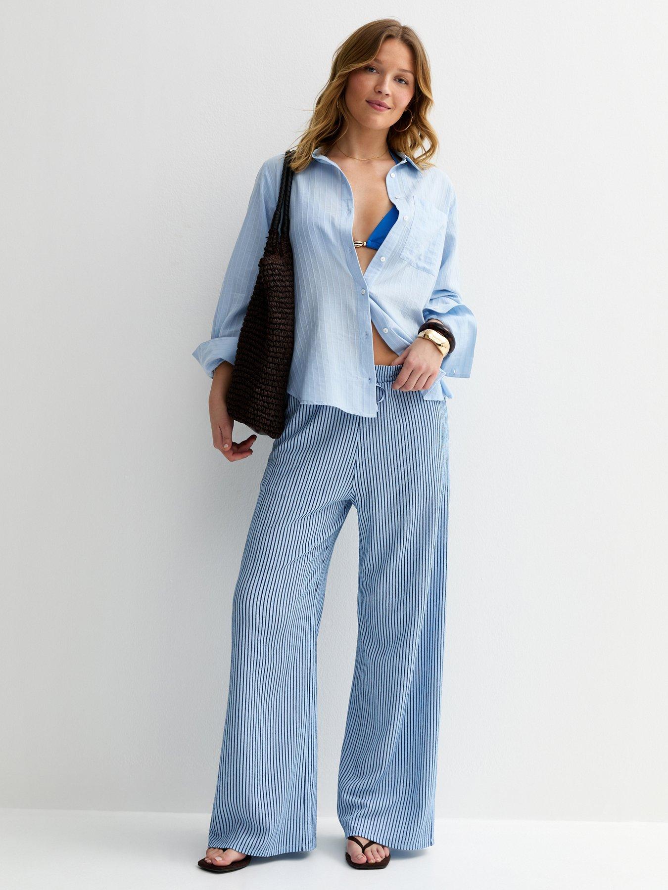 Image 1 of 5 of New Look Thin Stripe Crinkle Texture Wide Leg Trousers - Blue
