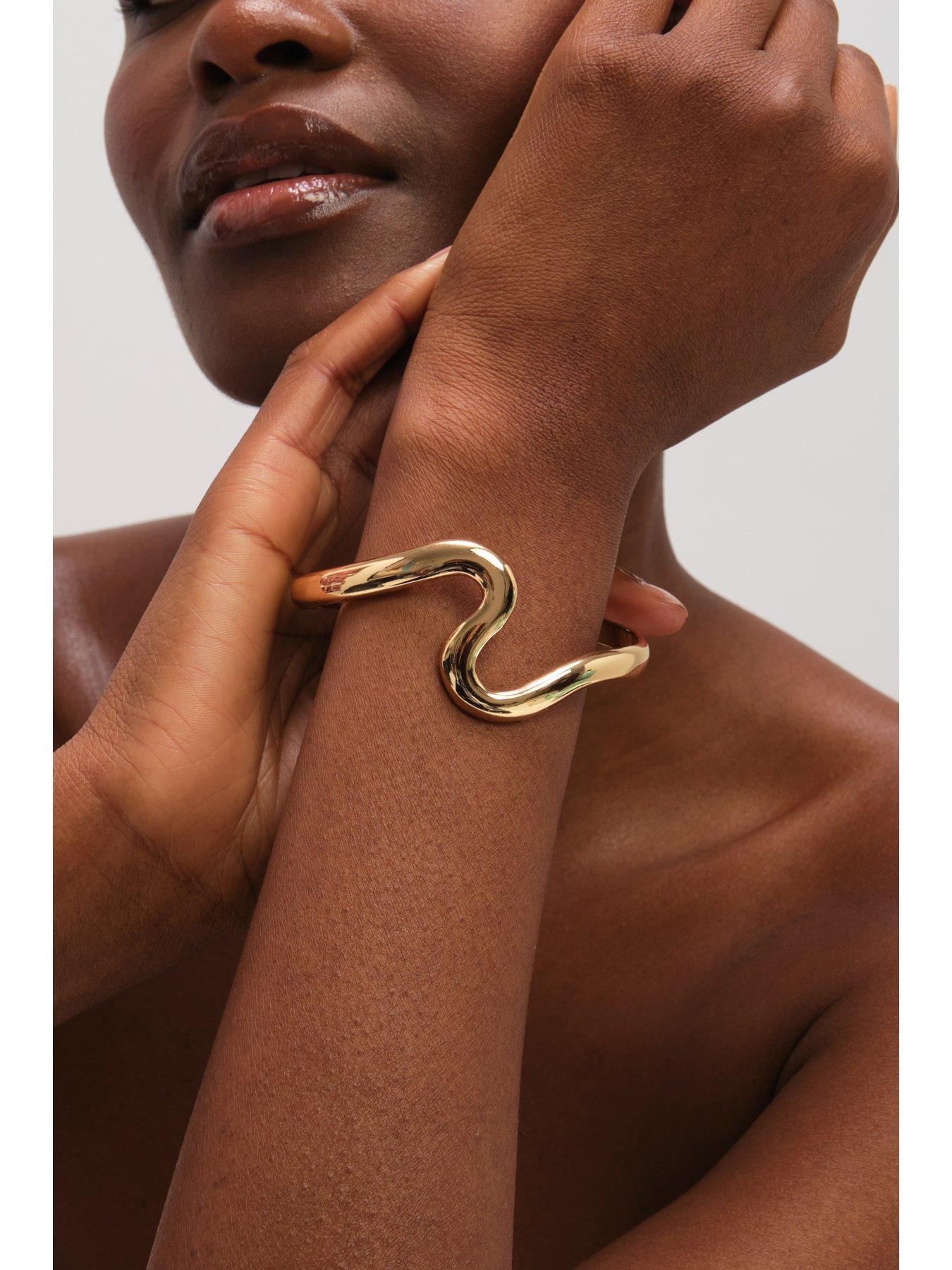 jon-richard-gold-plated-polished-swirl-banglestillFront