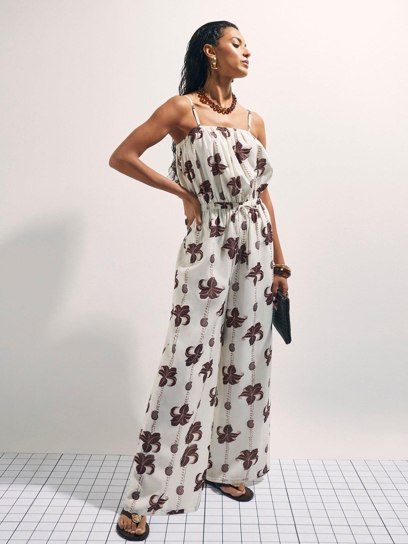 Image 1 of 6 of River Island Palm Print Jumpsuit - Cream