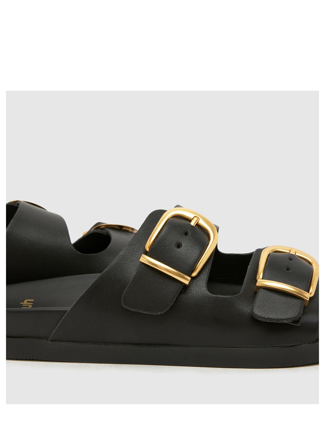 schuh-trish-buckle-footbed-sandal-blackstillFront