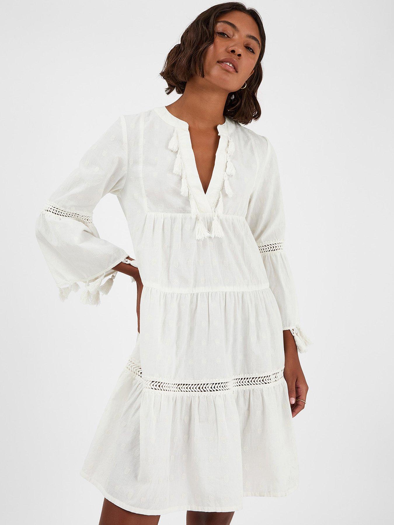 Image 1 of 4 of Accessorize Flute Sleeve Tassel Tiered Mini Dress
