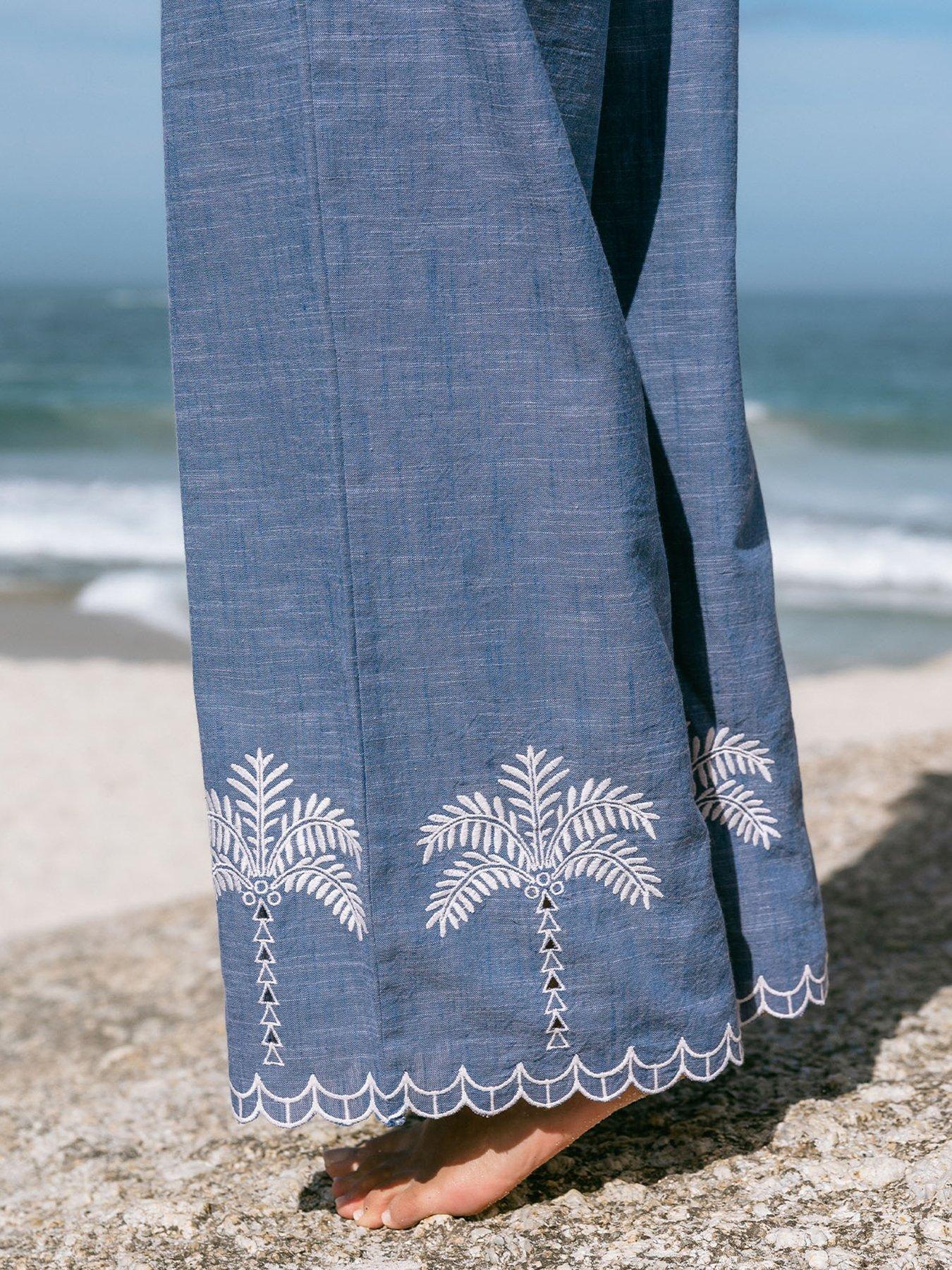 Image 4 of 5 of CHELSEA PEERS Chelsea Peers Embroidered Chambray&nbsp;Cotton Scallop Edge Wide Leg Trousers - Blue