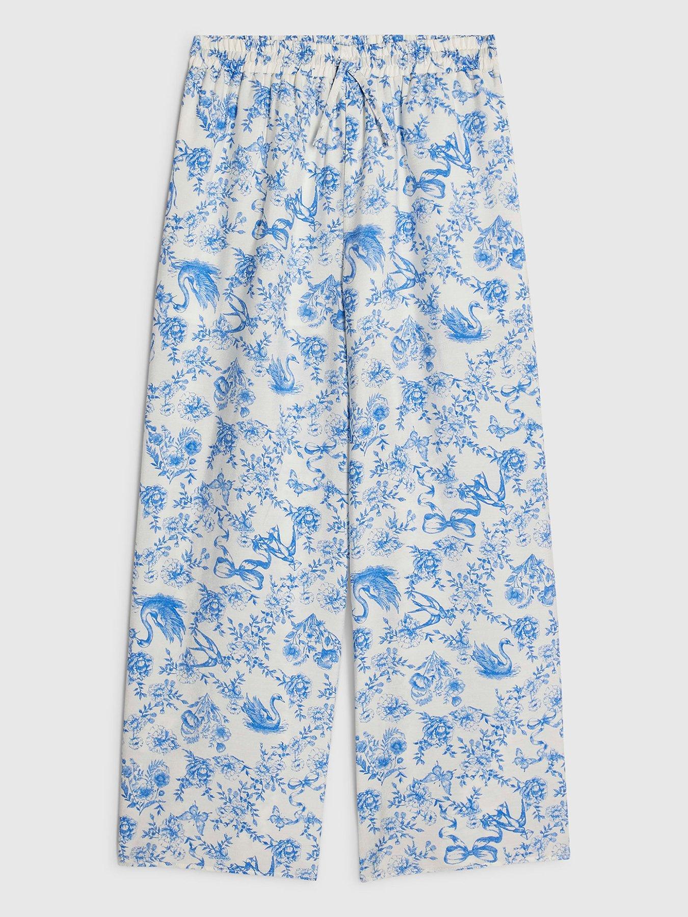 Image 1 of 4 of River Island Older Girls Floral Santorini Toile Trousers - Blue