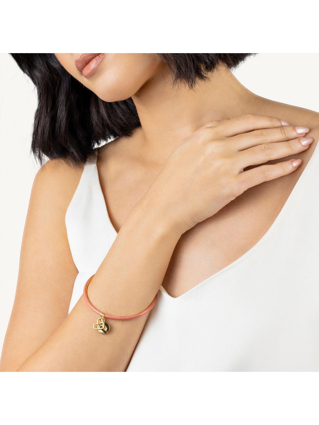 radley-radley-gold-and-carnation-enamel-bangle-with-hanging-charmsstillFront