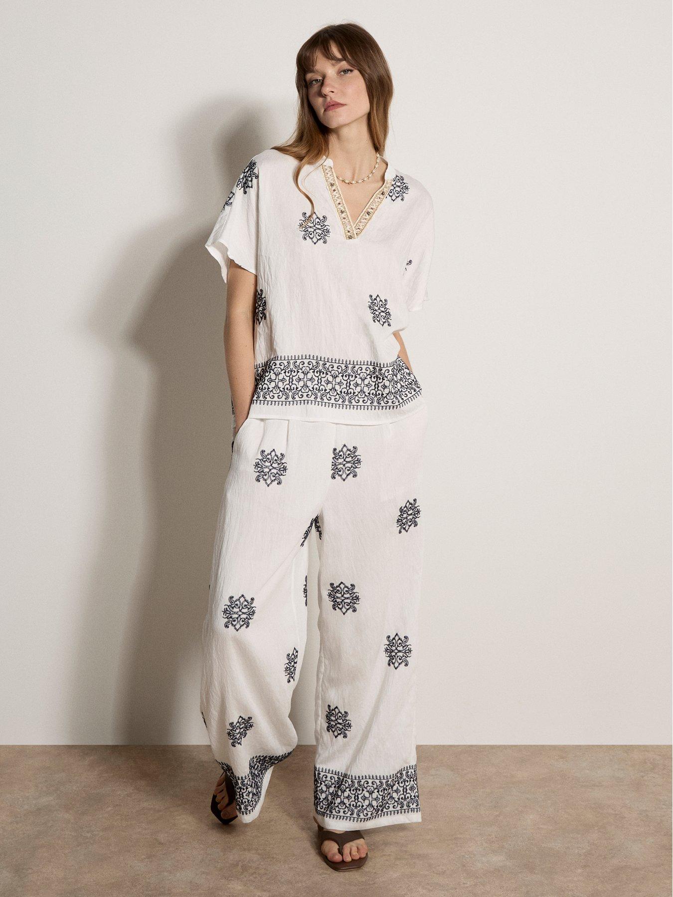 apricot-paisley-border-embroidered-trousersback