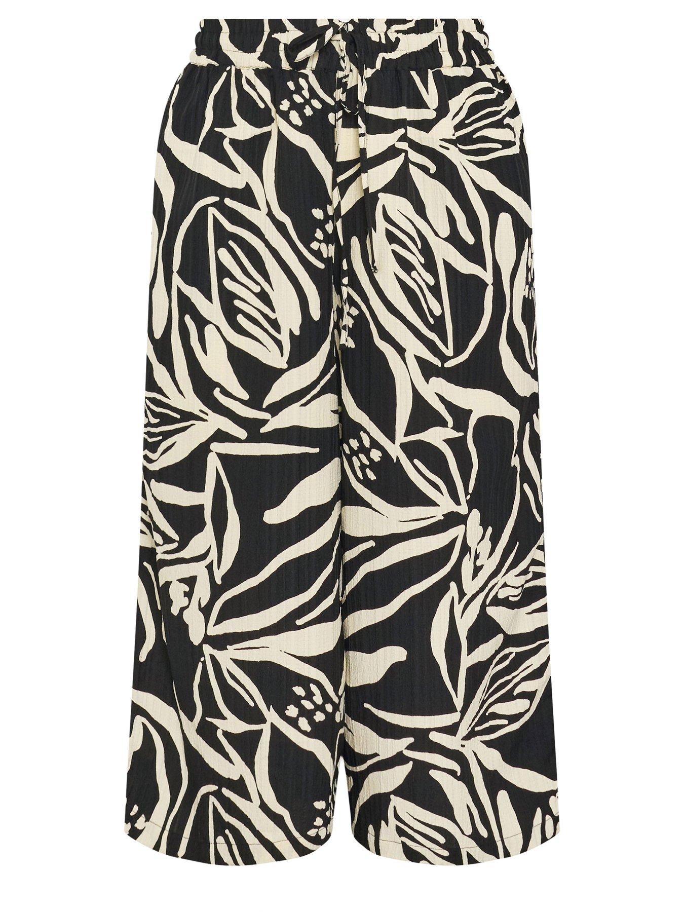 Image 5 of 5 of Yours Curve Pull On Palm Print Crop Trousers - Black