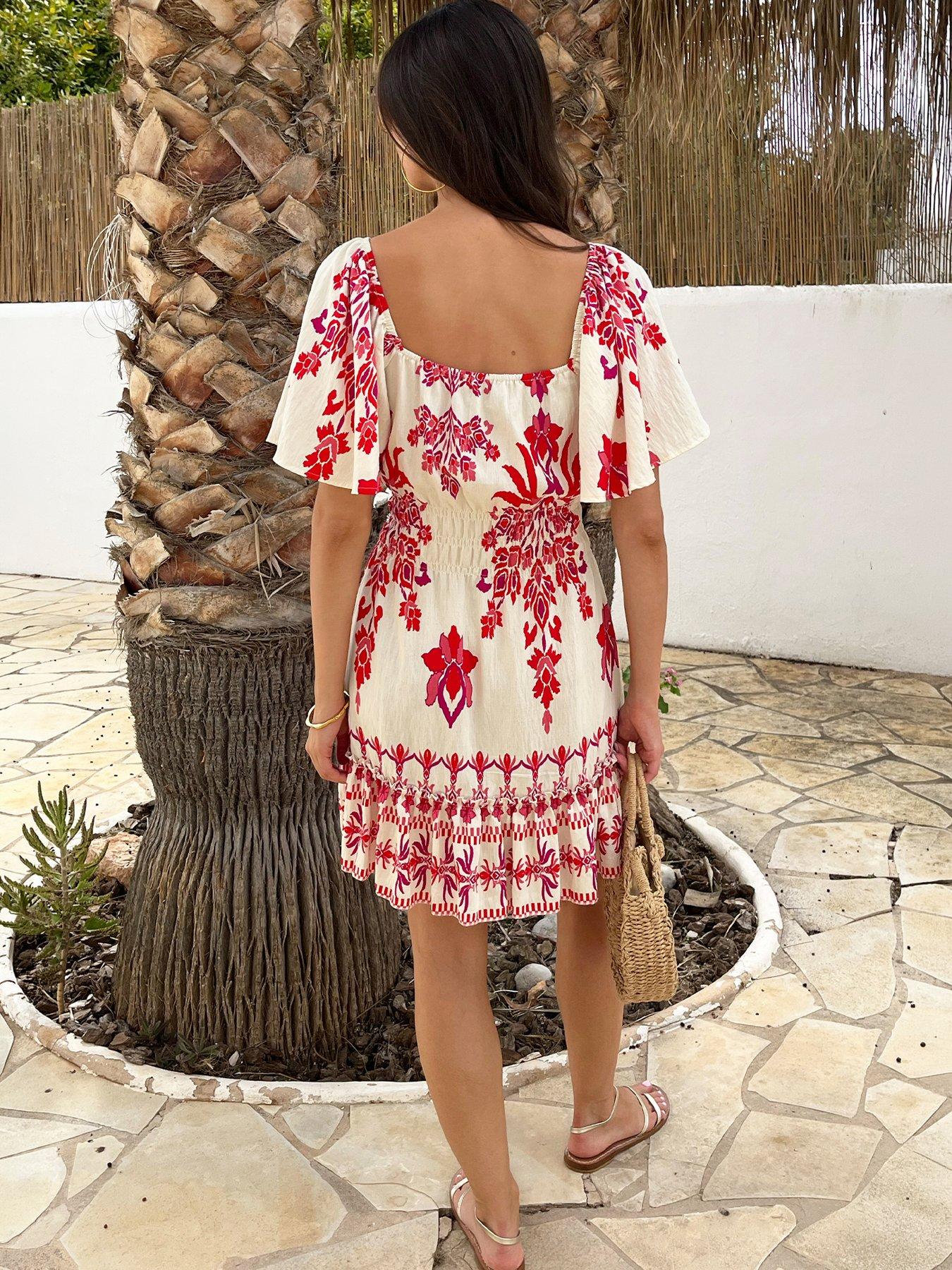 Image 2 of 4 of AX Paris Boho Floral Print Frill Hem Shirred Waist Mini Dress - Pink