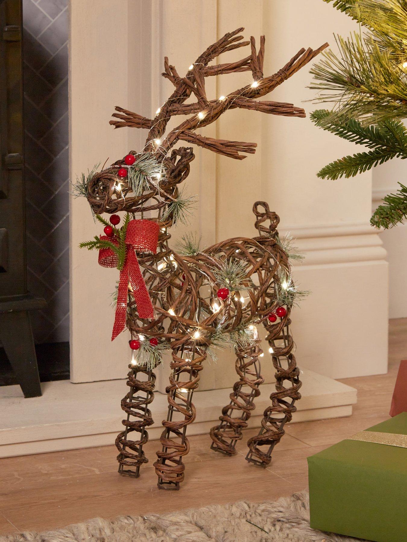 Image 1 of 7 of Heaven Sends Light Up Rattan Reindeer Christmas Decoration - 38 x 21 cm