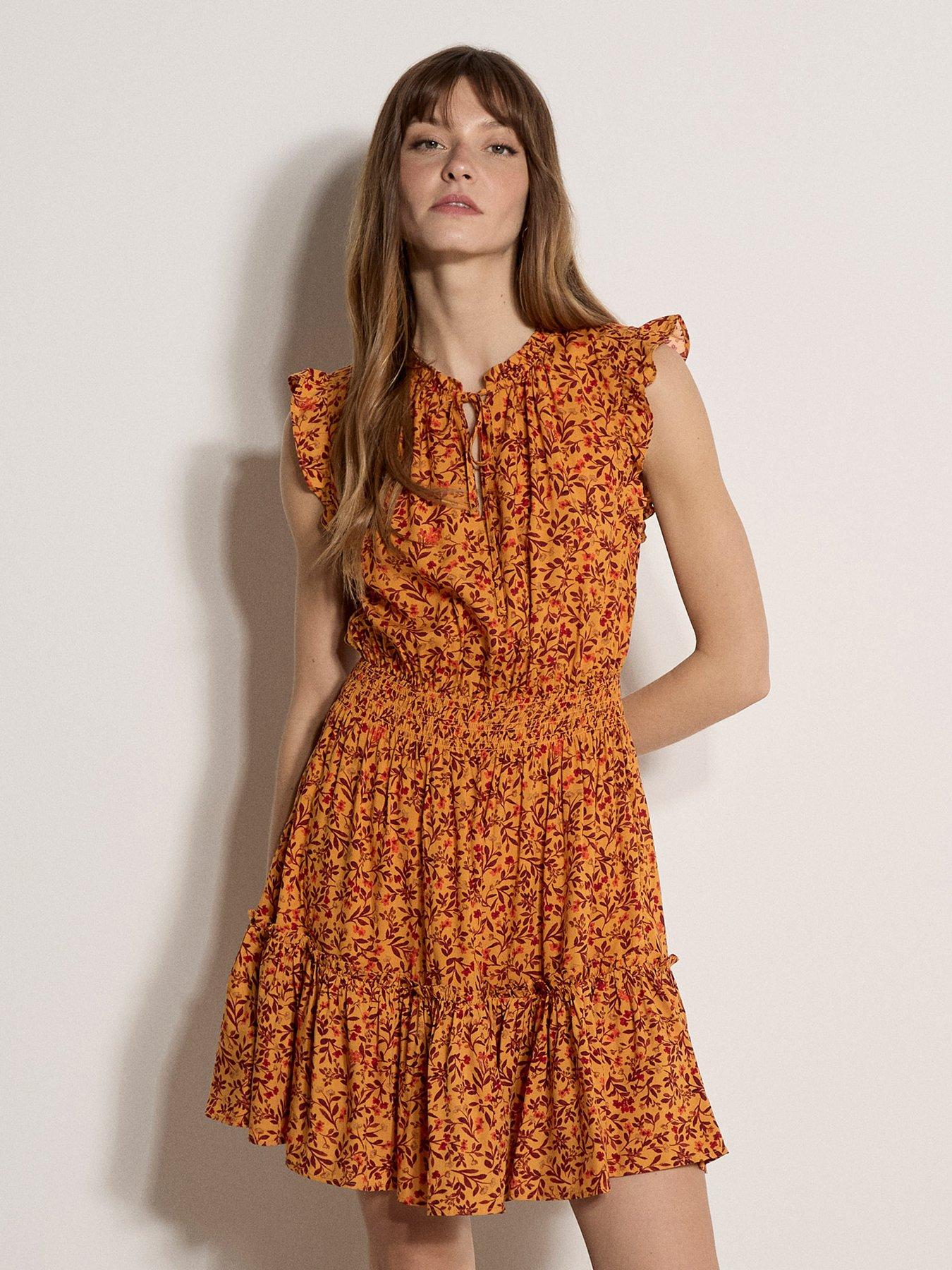Image 1 of 4 of Apricot Ruffle Tiered Ditsy Mini Dress