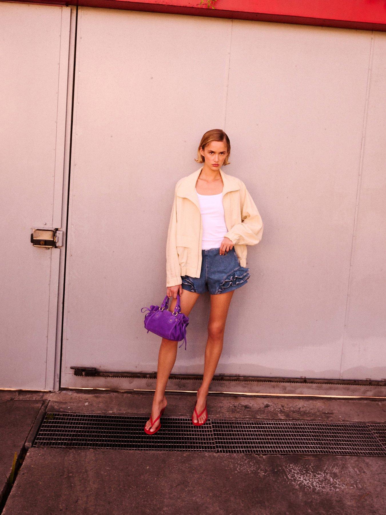 Image 2 of 7 of Mango Starring Hailey Bieber Frilled Denim Mini Shorts - Blue