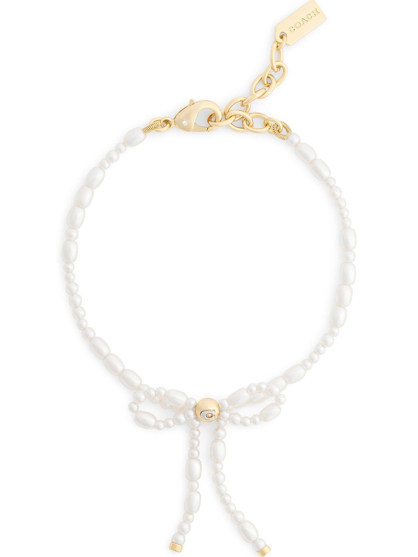 Image 1 of 3 of COACH Pearl Bow Flex Bracelet