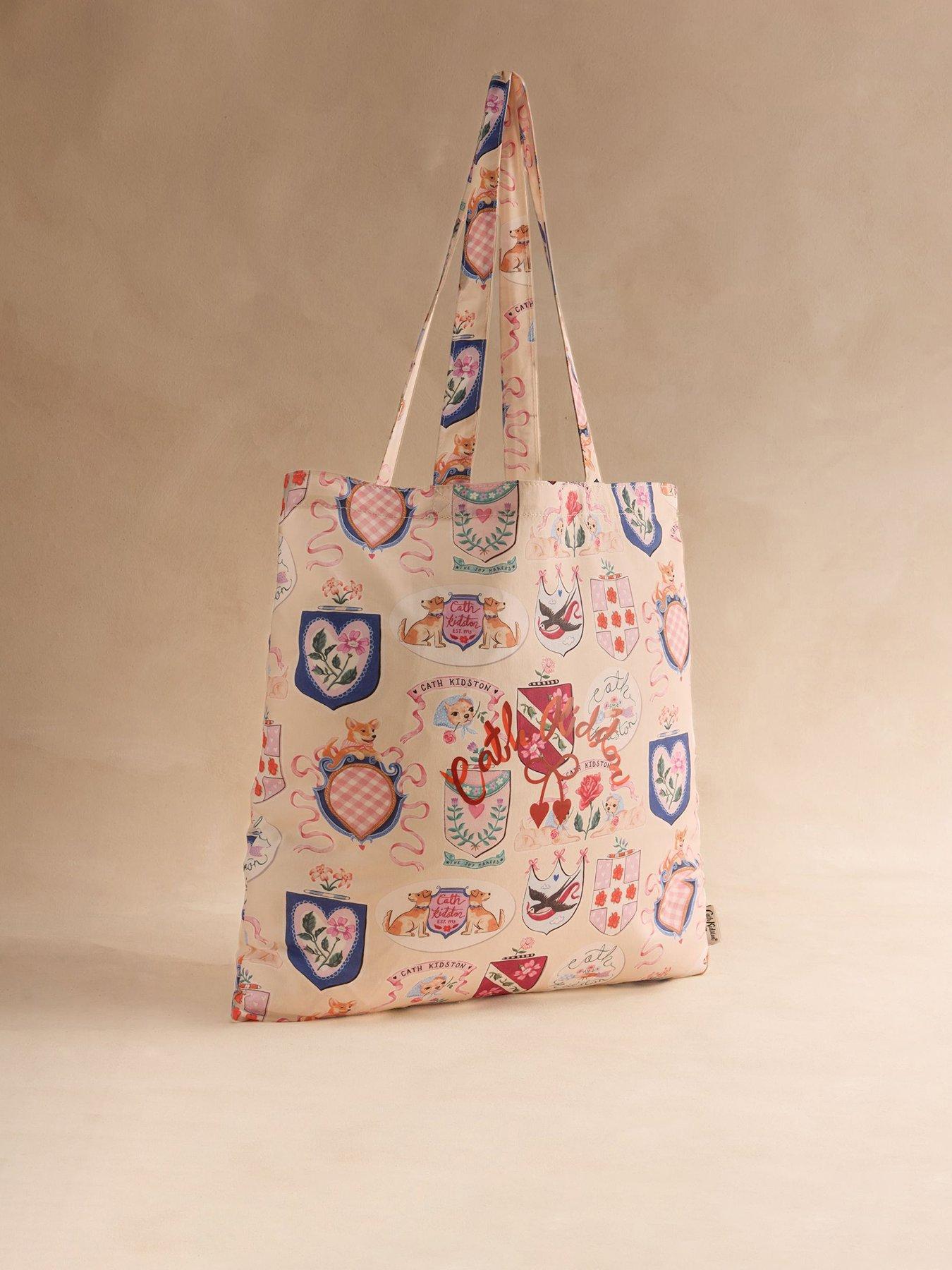 Image 1 of 4 of Cath Kidston Crest Of Joy Printed Book Bag - Cream