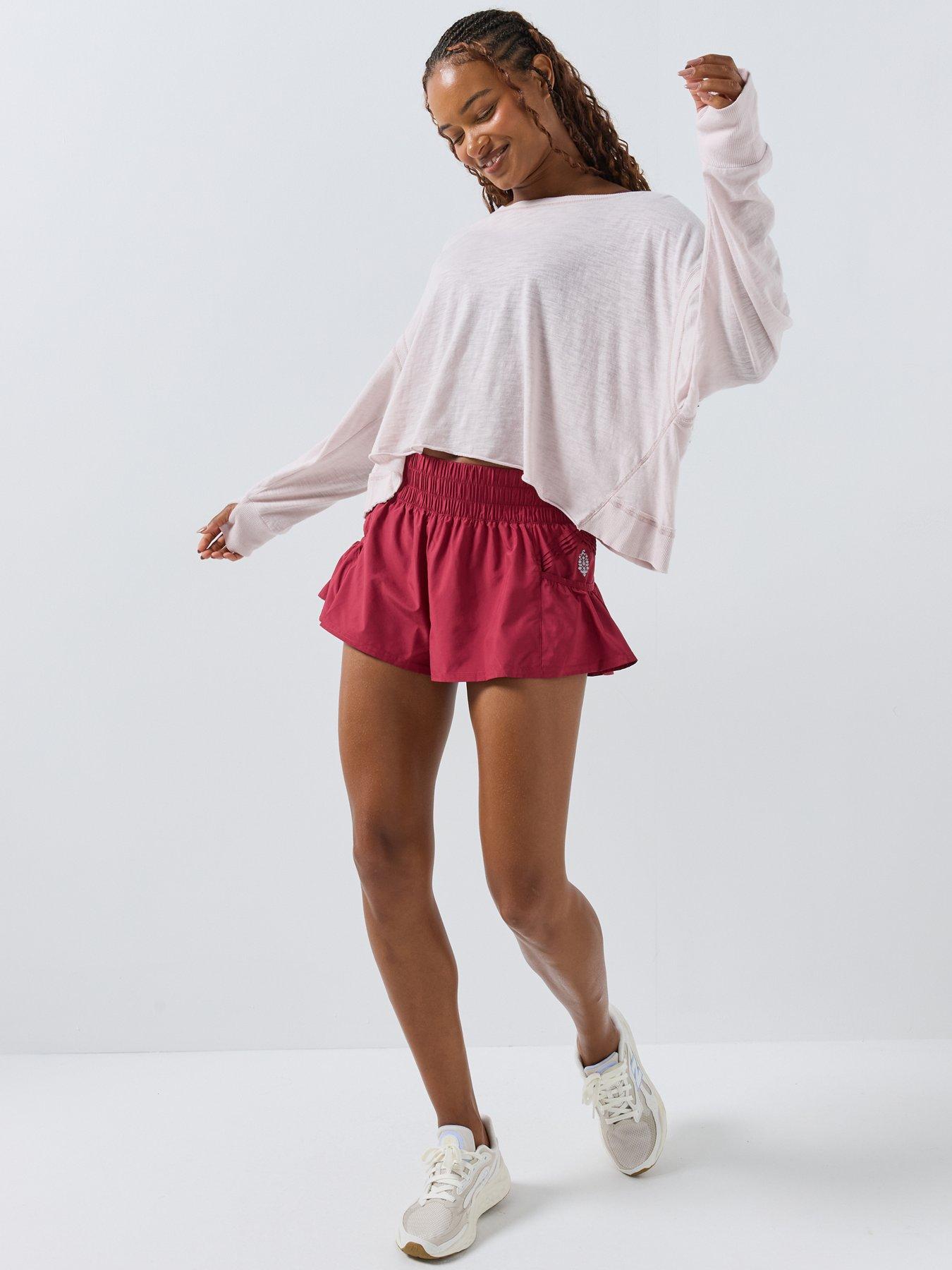 Image 3 of 6 of FP Movement FP Movement Get Your Flirt On Ruffle Hem Sports Shorts - Red