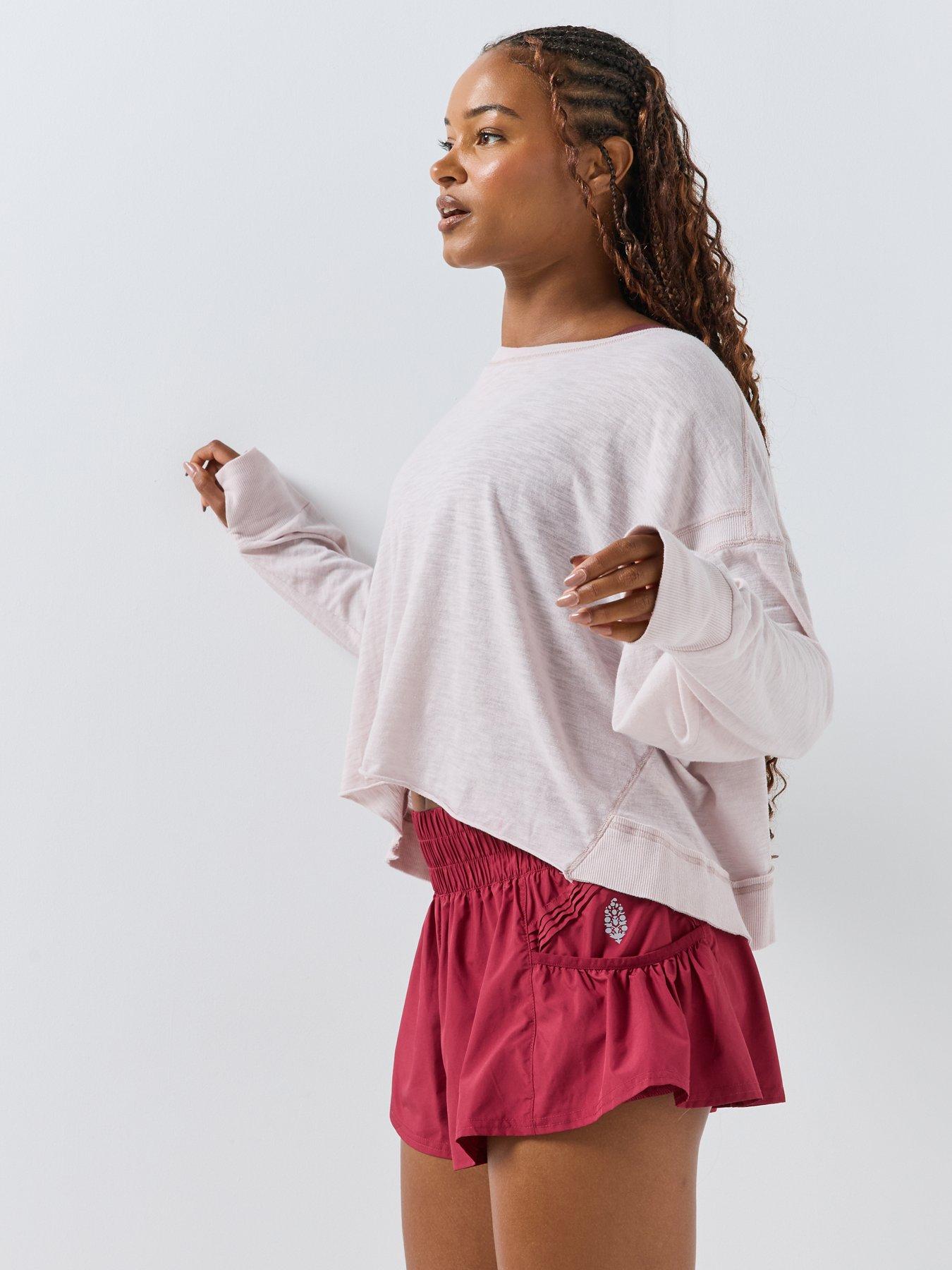Image 4 of 6 of FP Movement FP Movement Get Your Flirt On Ruffle Hem Sports Shorts - Red