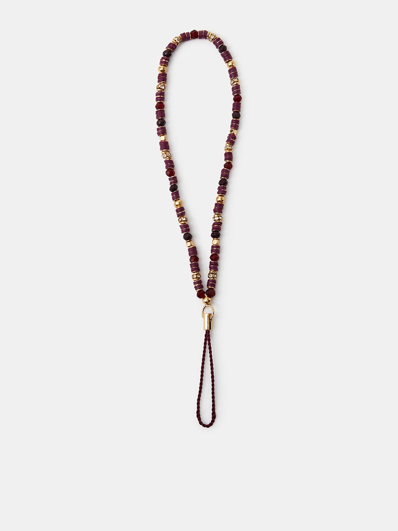 Image 1 of 3 of Accessorize Womens Beaded Gold-Tone Phone Charm - Red