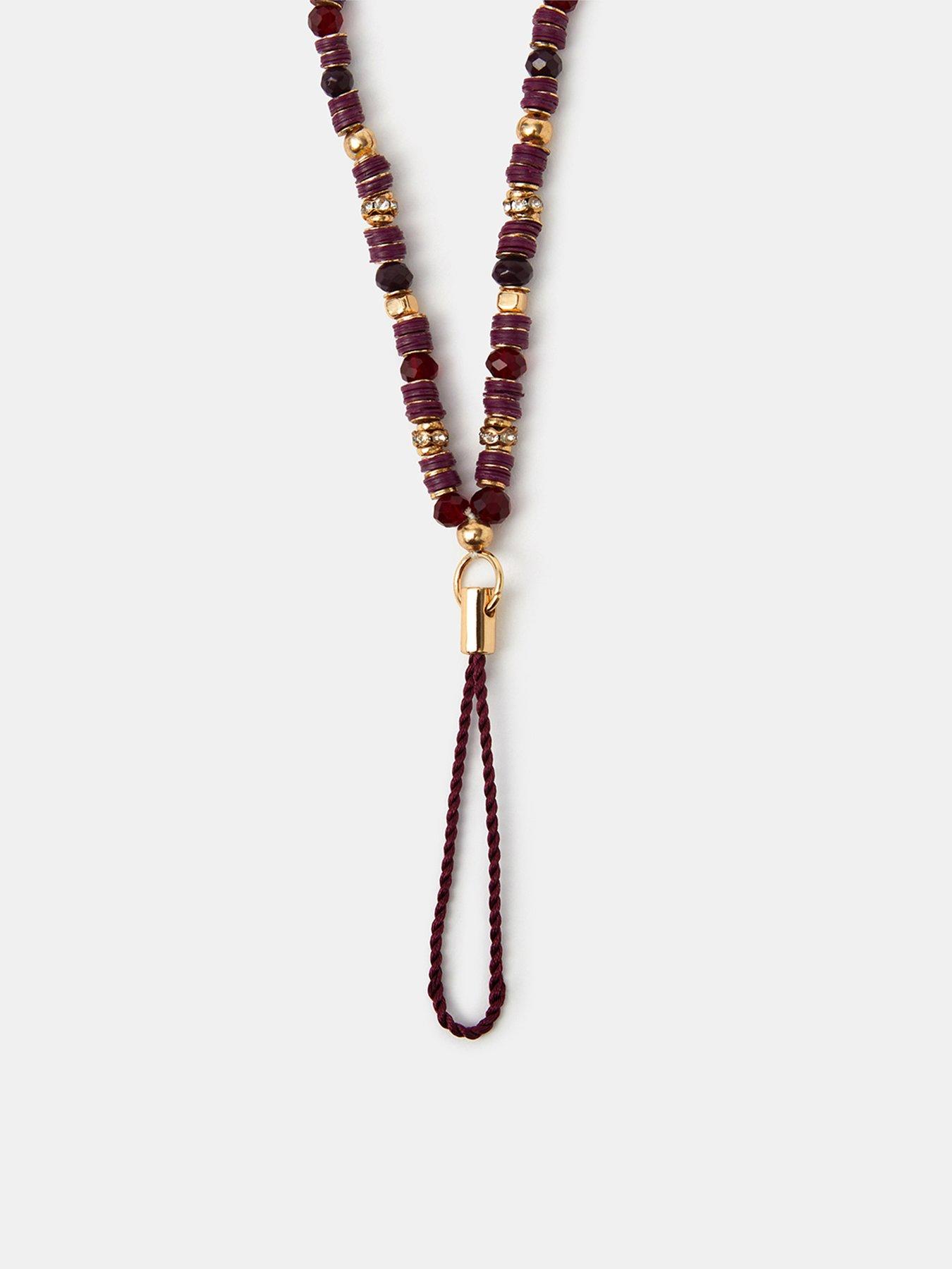 Image 2 of 3 of Accessorize Womens Beaded Gold-Tone Phone Charm - Red