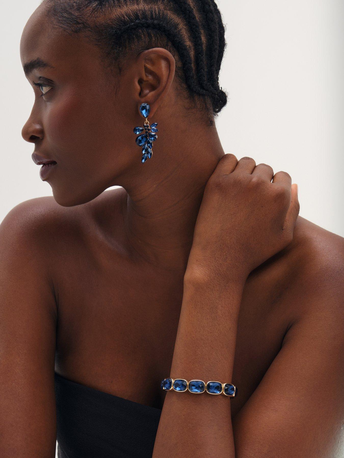 Image 3 of 3 of Mood Mood Gold Plated And Sapphire Leaf Statement Earrings