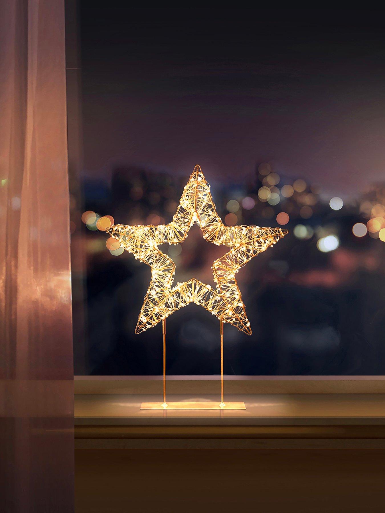 Image 1 of 5 of Premier Decorations 45cm Twinkling Lit Rose Gold Table Top Star