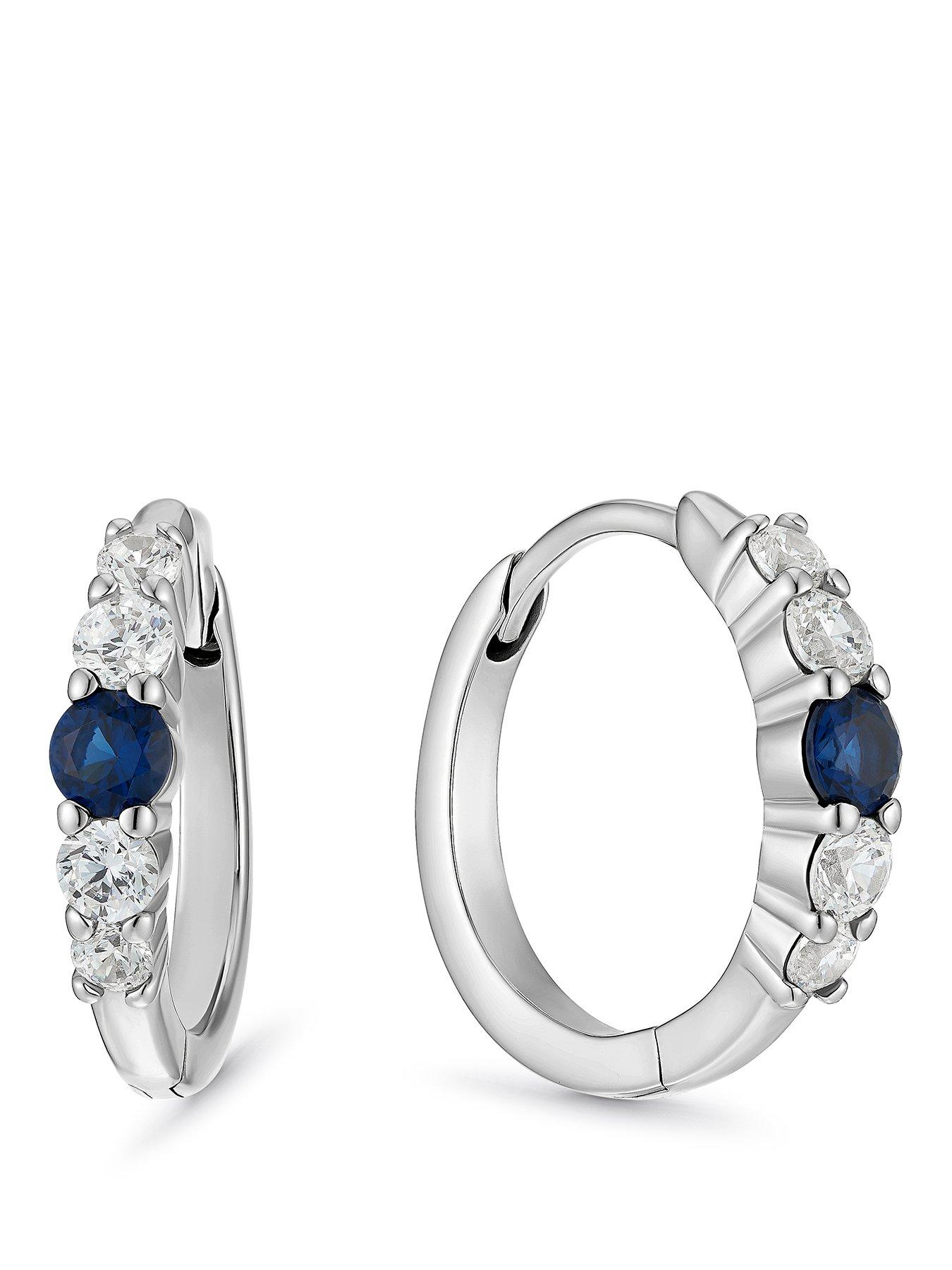 Image 1 of 2 of Ernest Jones Womens Cubic Zirconia Blue Stone Huggie Earrings - Silver