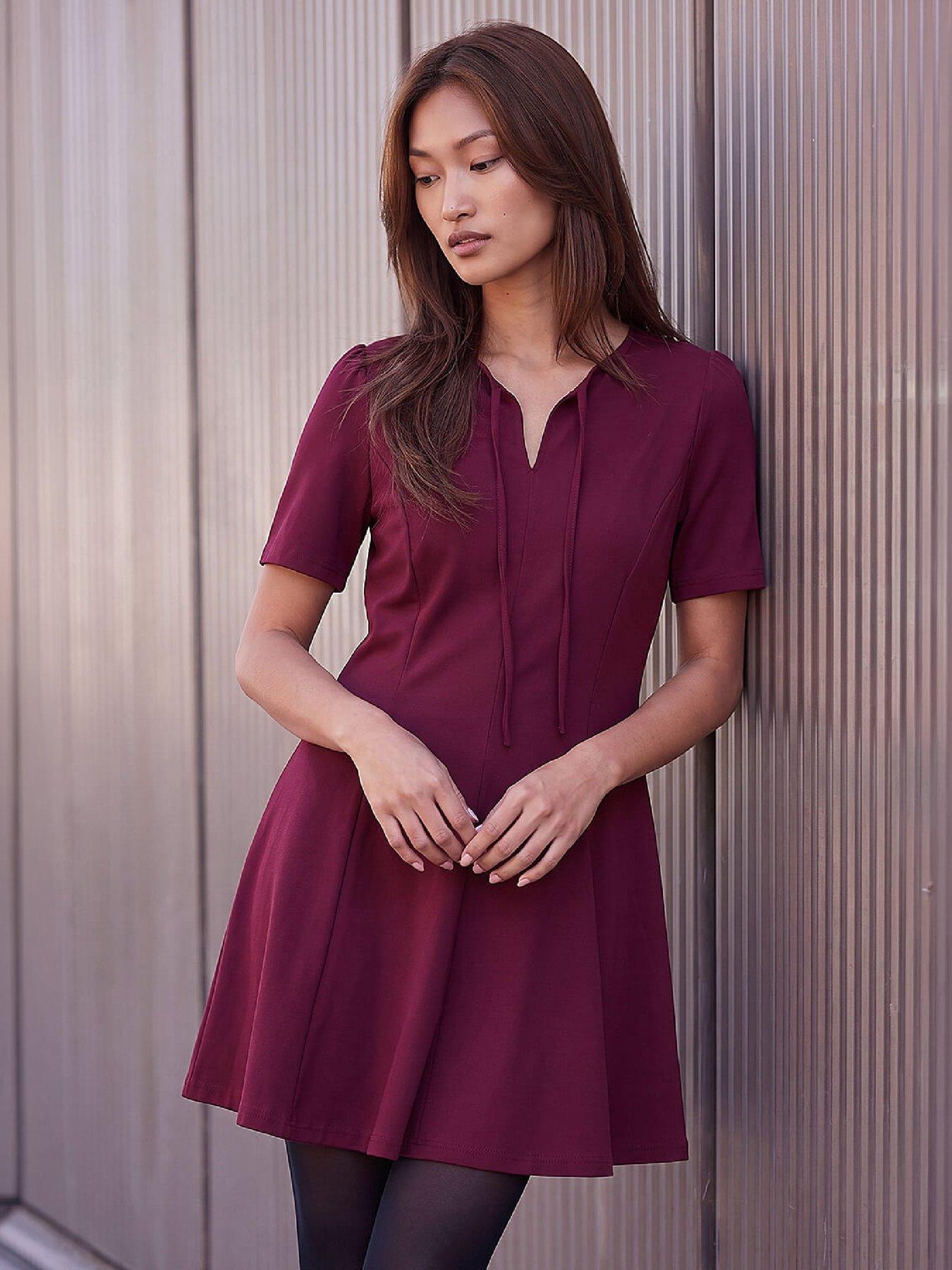 Image 1 of 4 of Roman Bow Detail Short Dress
