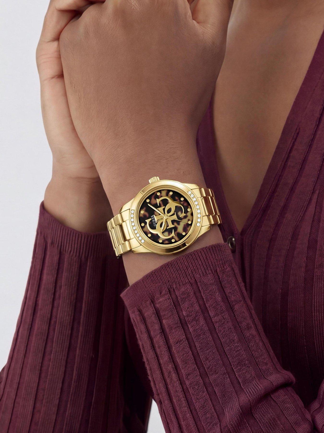 Image 2 of 6 of Guess GUESS Ladies Gold tone stone set watch with black dial and gold tone G logo detail
