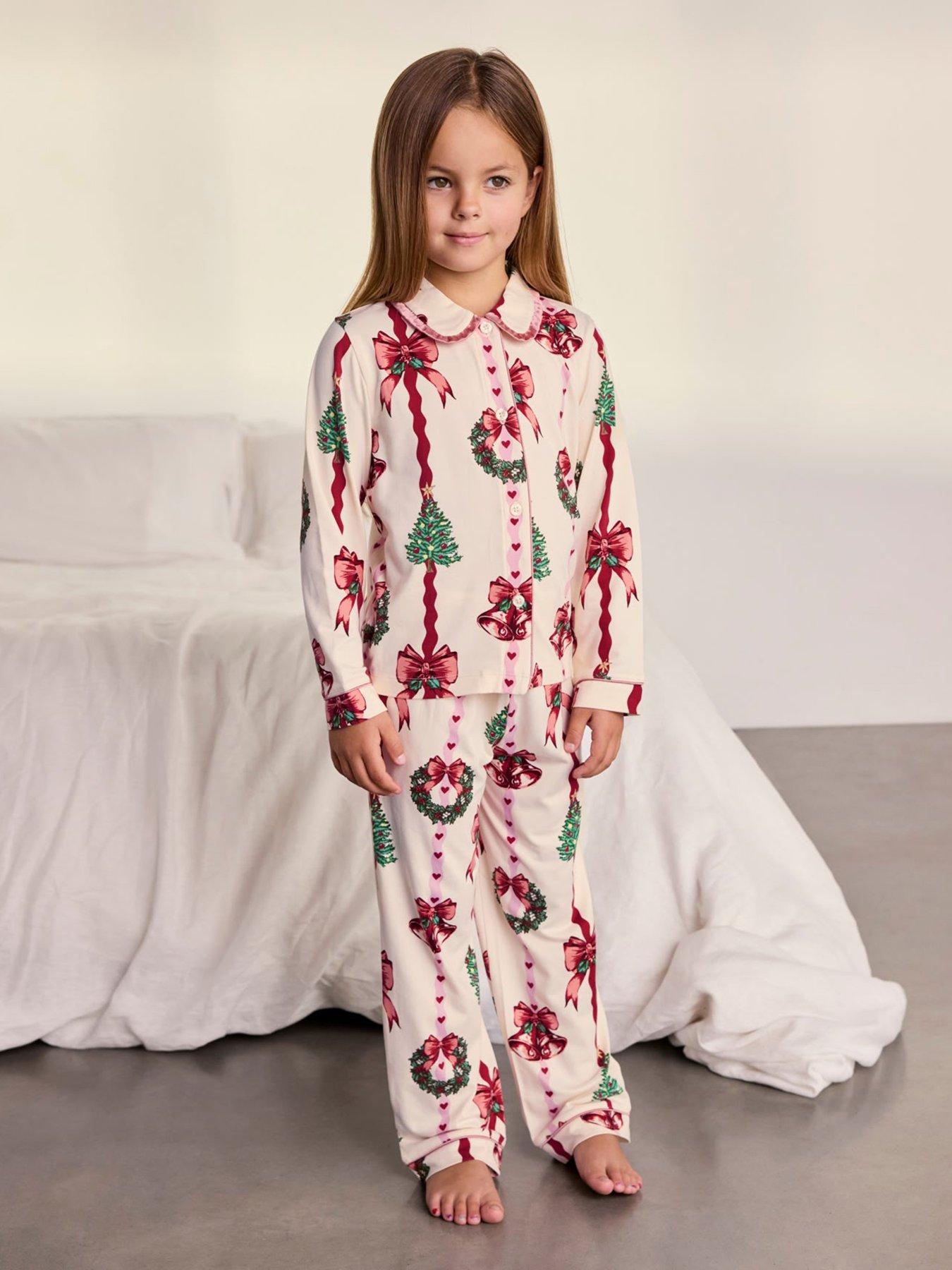 Image 1 of 7 of CHELSEA PEERS Chelsea Peers Kids Christmas Ribbon Stripe Print Long Pyjama Set - Off White